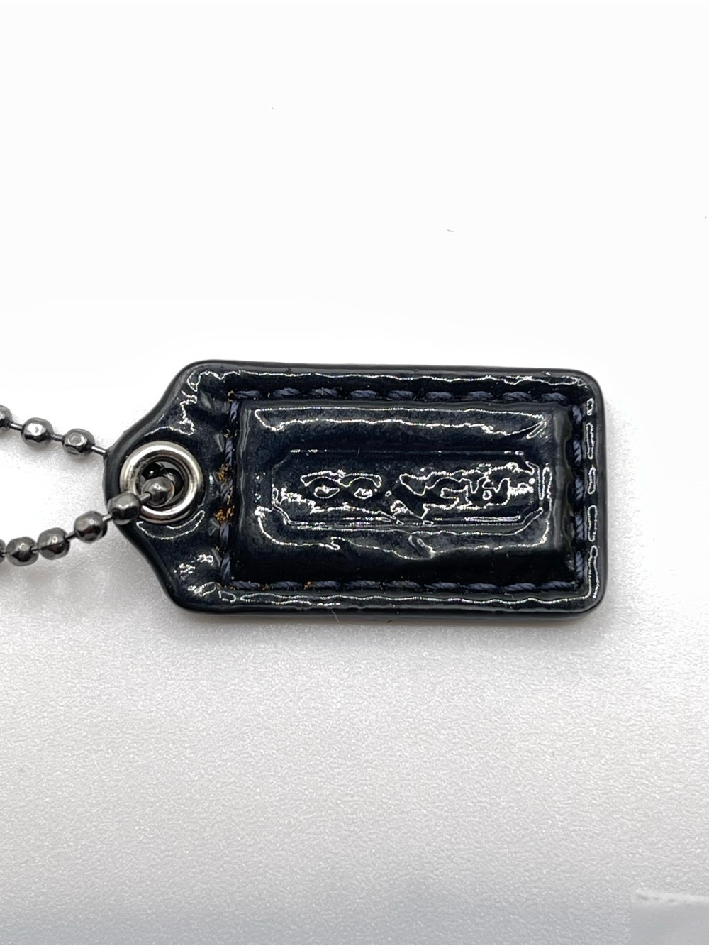 Coach Dark Blue Mini Patent Leather Hang Tag